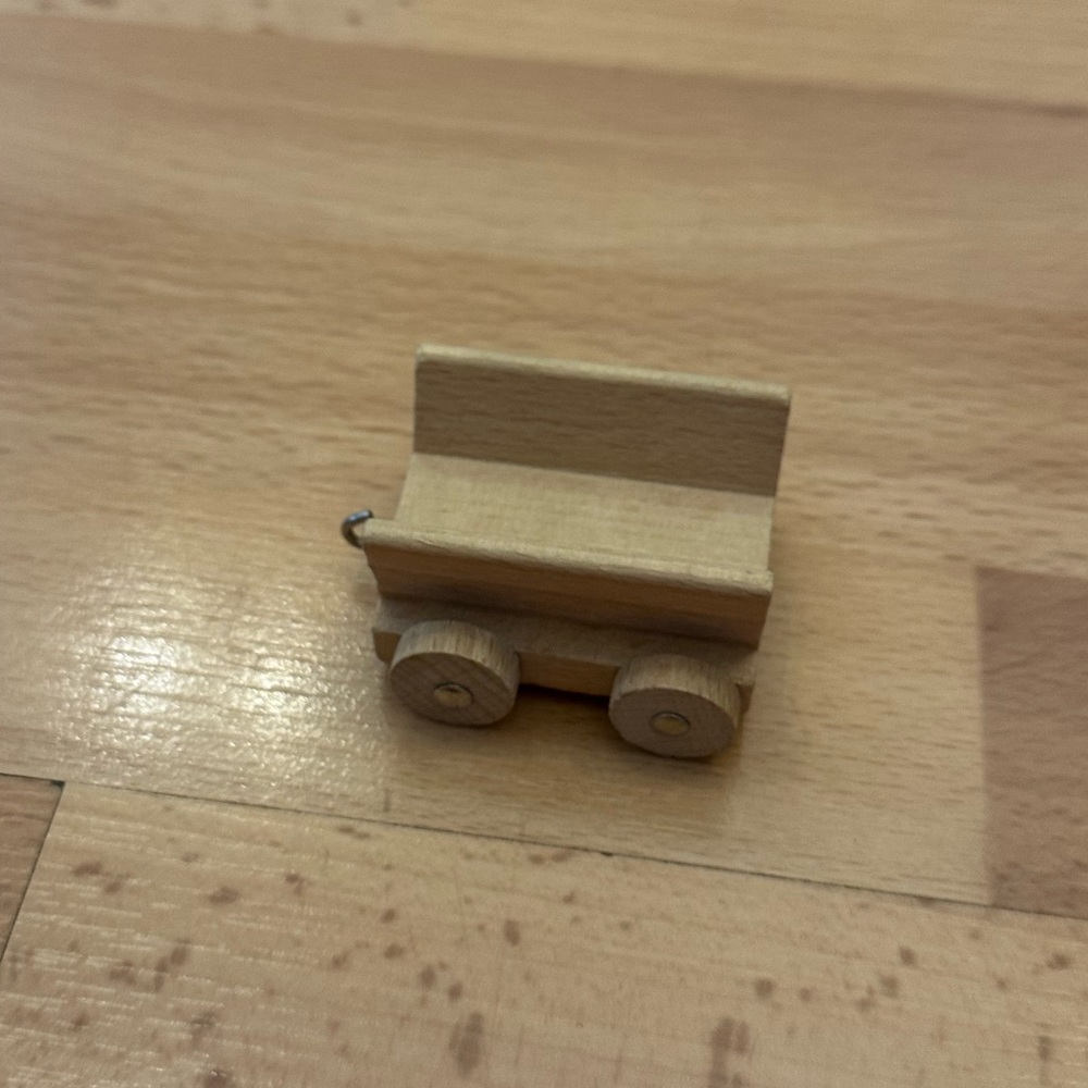 Little wooden cart with wheels